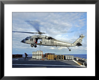 An Mh-60S Seahawk Helicopter Prepares To Deliver Ammunition by Stocktrek Images Pricing Limited Edition Print image