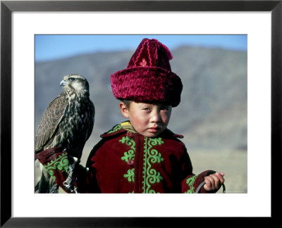 Young Boy Holding A Falcon, Golden Eagle Festival, Mongolia by Amos Nachoum Pricing Limited Edition Print image