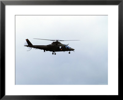 The Agusta A-109 Helicopter Of The Belgian Army In Flight by Stocktrek Images Pricing Limited Edition Print image