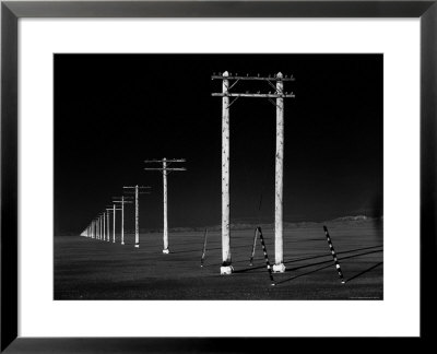 Row Of Telephone Poles Along Bonneville Salt Flats by Fritz Goro Pricing Limited Edition Print image
