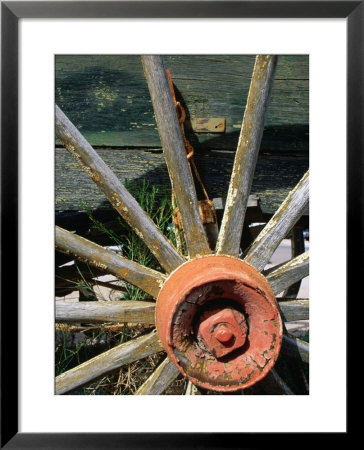 Close Up Of An Old Wooden Wagon Wheel,Tombstone, Arizona, Usa by Richard Cummins Pricing Limited Edition Print image