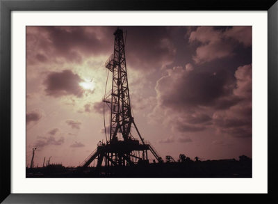 Silhouette Of An Oil Rig At Sunset by William Swartz Pricing Limited Edition Print image