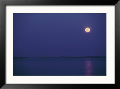 Purple Sky And Moon Over A Body Of Water by Kenneth Garrett Pricing Limited Edition Print image