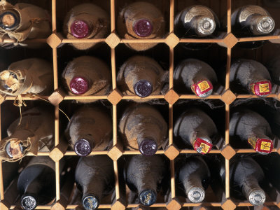 Wine Bottles Resting In Wine Rack by Rick Strange Pricing Limited Edition Print image