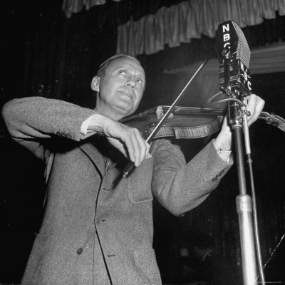 Comedian Jack Benny Playing Trademark Violin Into Microphone During His Nbc Radio Show by Herbert Gehr Pricing Limited Edition Print image
