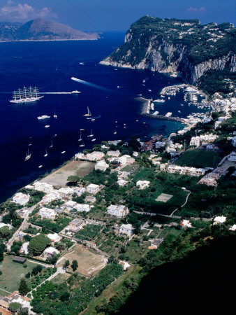 Capri Town, Port And Mt. Tiberio With Mainland In Distance, Capri, Italy by Dallas Stribley Pricing Limited Edition Print image