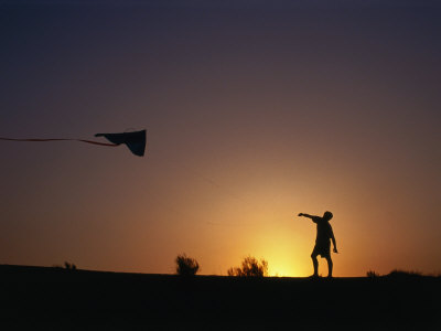 Boy Flying Kite At Sunset, England, United Kingdom by Chris Mellor Pricing Limited Edition Print image
