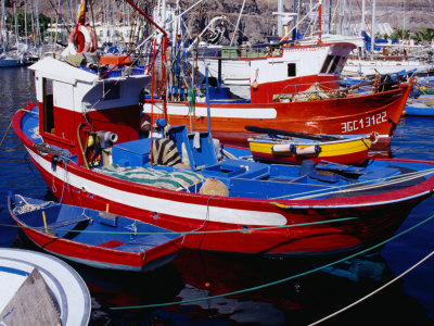 Moored Fishing Boats, Puerto De Mogan, Canary Islands, Spain by Tony Wheeler Pricing Limited Edition Print image