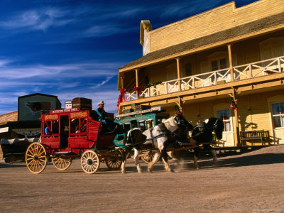 Stagecoach In Motion At Old Tucson Studios by Eddie Brady Pricing Limited Edition Print image