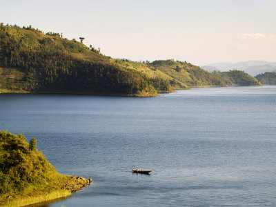 Passenger Boat On Lake Burera Near Ruhengeri At The Virunga Mountains, Rwanda by Ariadne Van Zandbergen Pricing Limited Edition Print image