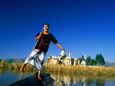 Woman Balancing In Boat On Lake, Inle Lake, Myanmar (Burma) by Juliet Coombe Pricing Limited Edition Print image