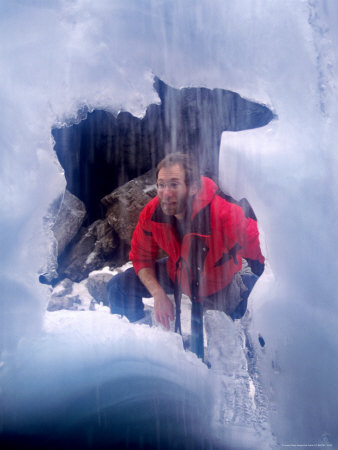 Man Looking Into Snow Cave, Maligne, Jasper, Canada by Lee Foster Pricing Limited Edition Print image