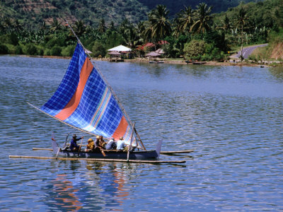 Outrigger Ferrying Passengers Across Bay At Lembar, Lombok, West Nusa Tenggara, Indonesia by Bernard Napthine Pricing Limited Edition Print image