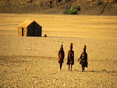 Himba Women Walking In The Desert, Near Purros, Namibia by Roger De La Harpe Pricing Limited Edition Print image