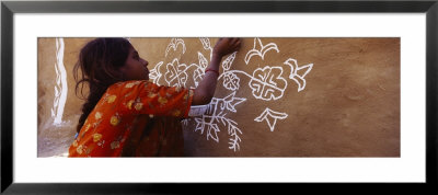 Girl Painting On A Wall, Thar Desert, Jaisalmer, Rajasthan, India by Panoramic Images Pricing Limited Edition Print image