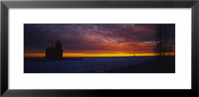 Silhouette Of A Light House At Sunset, Big Red Lighthouse, Holland, Michigan, Usa by Panoramic Images Pricing Limited Edition Print image