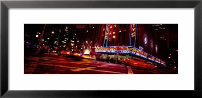 Buildings Lit Up At Night, Radio City Music Hall, Rockefeller Center, Manhattan, New York, Usa by Panoramic Images Pricing Limited Edition Print image