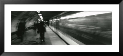 Subway Train Passing Through A Subway Station, London, England by Panoramic Images Pricing Limited Edition Print image