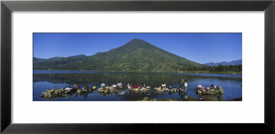 Women Washing Clothes In A Lake, Santiago, Lake Atitlan, Guatemala by Panoramic Images Pricing Limited Edition Print image