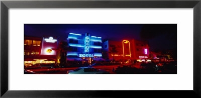 Low Angle View Of A Hotel Lit Up At Night, Miami, Florida, Usa by Panoramic Images Pricing Limited Edition Print image