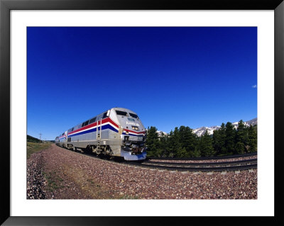 Amtrak Train At Marias Pass, Montana, Usa by Chuck Haney Pricing Limited Edition Print image