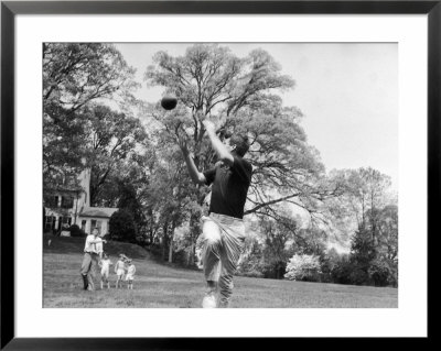 Robert F Kennedy And Family Outside Playing Football With His Brother Senator John F. Kennedy by Paul Schutzer Pricing Limited Edition Print image