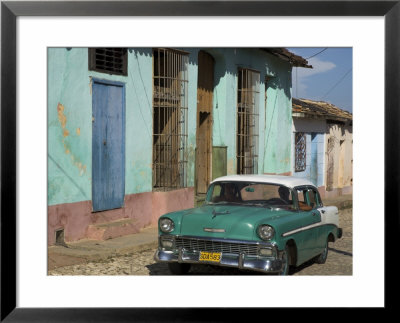 Typical Paved Street With Colourful Houses And Old American Car, Trinidad, Cuba, West Indies by Eitan Simanor Pricing Limited Edition Print image