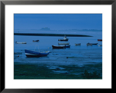 Small Fishing Boats Line The Shore At The North End Of Lindisfarne by Sisse Brimberg Pricing Limited Edition Print image