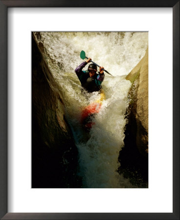 A Kayaker Sails Over A Waterfall And Is Headed For The Rough White Water Below by Barry Tessman Pricing Limited Edition Print image