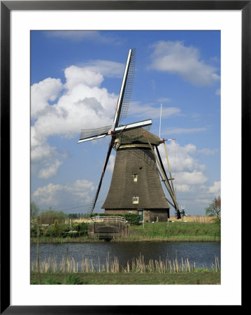 Canal And Windmill At Kinderdijk, Unesco World Heritage Site, Holland by Gavin Hellier Pricing Limited Edition Print image