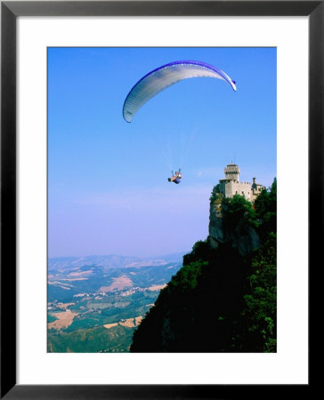 Person Hang-Gliding Over Castle With Countryside Beyond, San Marino, San Marino by John Elk Iii Pricing Limited Edition Print image