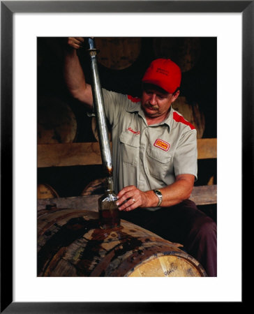 Taking Sample From Whisky Barrel At Makers Mark Distillery, Bardstown, United States Of America by Richard I'anson Pricing Limited Edition Print image