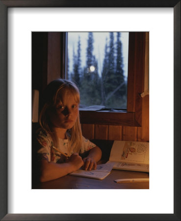 A Young Girl Being Schooled At Her Home In Alaska by Michael S. Quinton Pricing Limited Edition Print image