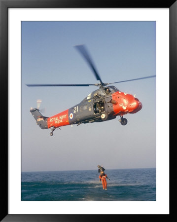 Wessex Helicopter Winching Up Survivior In Rescue From Sea by R H Productions Pricing Limited Edition Print image