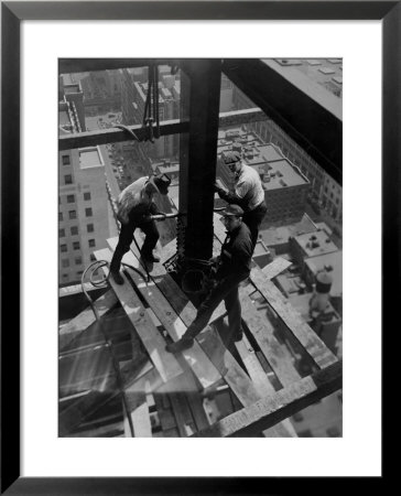 Workmen Attach Steel Beams Above Street During Construction Of The Manhattan Company Building by Arthur Gerlach Pricing Limited Edition Print image