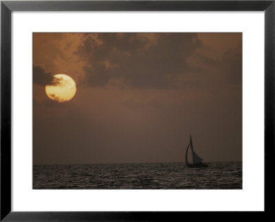 A Cat Boat Takes A Sunset Cruise About The Miskito Cays by Bill Curtsinger Pricing Limited Edition Print image
