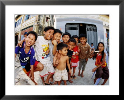 Group Of Children In Street, Kampot, Cambodia by Christopher Groenhout Pricing Limited Edition Print image