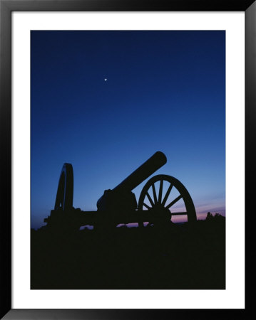 Silhouette Of A Civil War Era Cannon At Twilight by Kenneth Garrett Pricing Limited Edition Print image