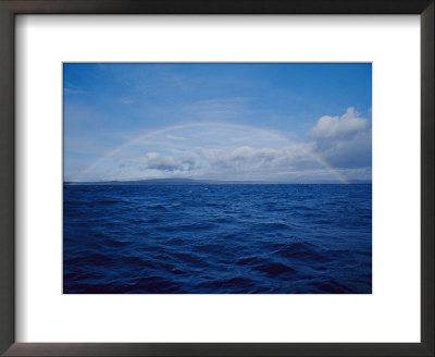 A Rainbow Rises Over The Waters Surface In Twofold Bay by Jason Edwards Pricing Limited Edition Print image