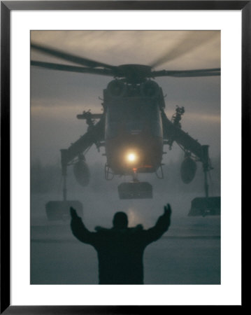 A Man Guides A Landing Helicopter by Lowell Georgia Pricing Limited Edition Print image