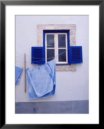 Laundry Hanging On Line At Window In The Moorish Quarter Of Alfama, Lisbon, Portugal by Yadid Levy Pricing Limited Edition Print image