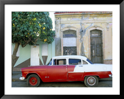 Old American Car Parked On Beneath Fruit Tree, Cienfuegos, Cuba, West Indies, Central America by Lee Frost Pricing Limited Edition Print image
