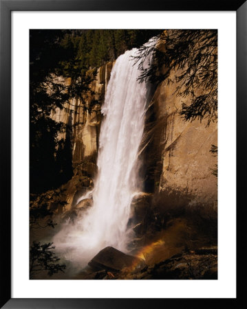 A Waterfall In Yosemite National Park In California by Paul Nicklen Pricing Limited Edition Print image