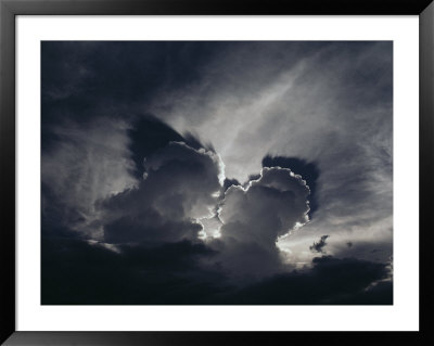 Sunlight Peers From Behind Storm Clouds Over Papua New Guinea by James P. Blair Pricing Limited Edition Print image