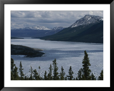 Snow-Capped Moutains Rise Above A Frozen Waterway On Kodiak Island by George F. Mobley Pricing Limited Edition Print image