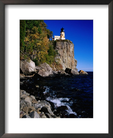 Split Rock Lighthouse On Cliff Overlooking Lake Superior, Split Rock State Park, Usa by Richard Cummins Pricing Limited Edition Print image