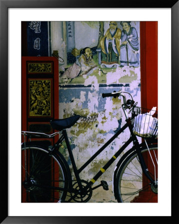 Bicycle Against Muralled Wall Of Chinese Temple At Marudi, Sarawak, Malaysia by Mark Daffey Pricing Limited Edition Print image