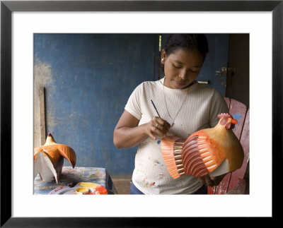 Woman Painting Balsa Wood Sculptures Of Chickens, Rio San Juan, Nicaragua by Margie Politzer Pricing Limited Edition Print image