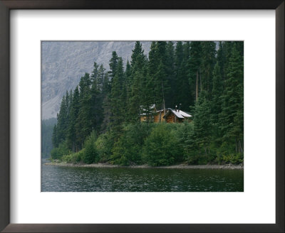 A Traditional Hunting And Fishing Lodge Built On Cli Lake by Raymond Gehman Pricing Limited Edition Print image