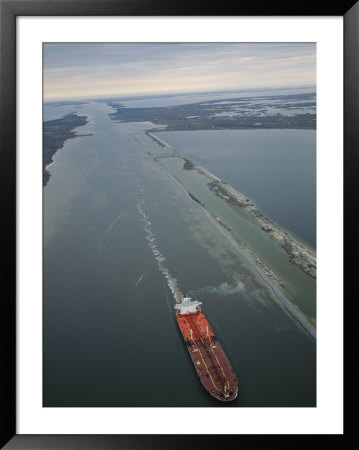An Aerial View Of A Barge Moving On The Intercoastal Waterway by Joel Sartore Pricing Limited Edition Print image
